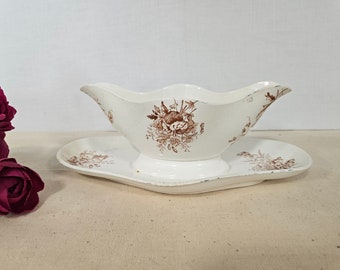 Old iron earth gravy boat model "Bouquets" from the French manufacture of Longwy