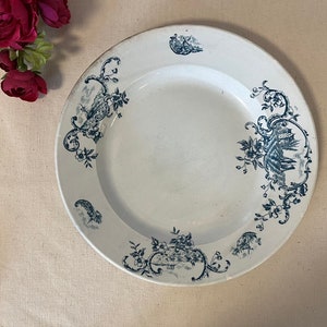 Antique round flat serving dish in ironstone, “Marine” model, French manufacturer