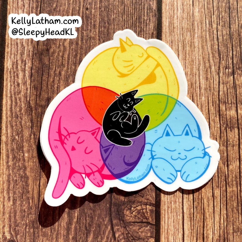 May include: A sticker featuring four cats in a circle, each cat is a different color: pink, yellow, blue, and purple. The cats are all sleeping and cuddling together. The sticker has the text "KellyLatham.com @SleepyHeadKL" at the top.