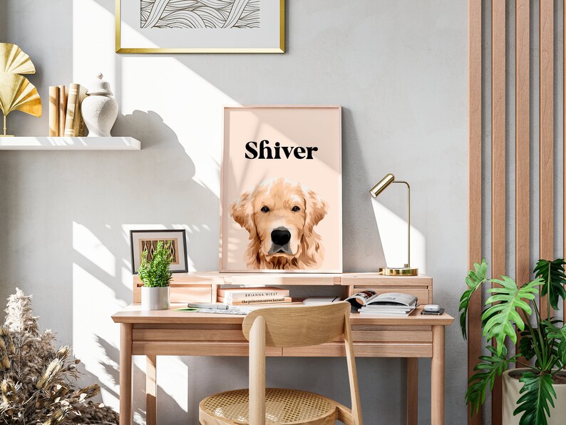 May include: A light pink framed print with a golden retriever dog's head and the word "Shiver" in black text.