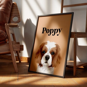 May include: A brown and white Cavalier King Charles Spaniel dog with the name "Poppy" printed in black text on a light brown background.