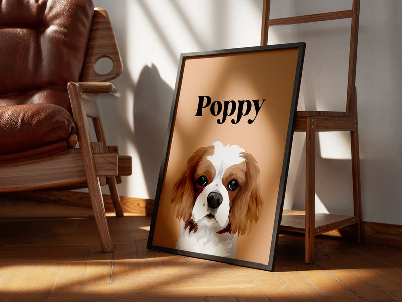 May include: A brown and white Cavalier King Charles Spaniel dog with the name "Poppy" printed in black text on a light brown background.