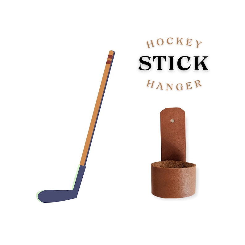 May include: A brown leather hockey stick hanger with the text "HOCKEY STICK HANGER" above it. The hanger is designed to hold a hockey stick upright.