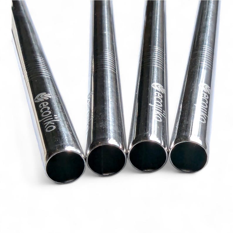 May include: Four silver reusable drinking straws with the word "ecojiko" engraved on each straw.
