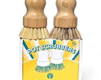 May include: Two wooden handled pot scrubbers with natural bristles in a yellow box with the text "POT SCRUBBERS" and the ecojiko logo.