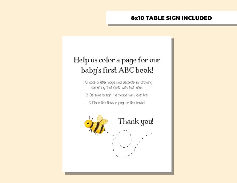 May include: A printable sign with a bee illustration and the text "Help us color a page for our baby's first ABC book!"  Choose a letter page and decorate by drawing something that starts with that letter. Be sure to sign the 'made with love' line. Place the finished page in the basket. Thank you!"