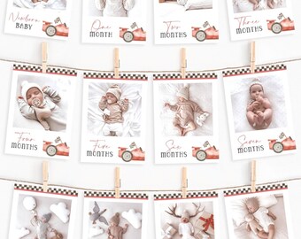 May include: A set of twelve baby milestone photo cards hanging on a string with wooden clothespins. Each card features a baby photo and a red race car graphic. Text on the cards reads "Newborn Baby" through "Eleven Months".