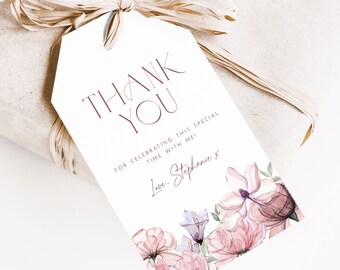 May include: A gift wrapped in brown paper, tied with raffia, and a white tag. The tag reads "THANK YOU" in burgundy script, with floral watercolor accents. Text on the tag says "For celebrating this special time with me! Love, Stephanie x."