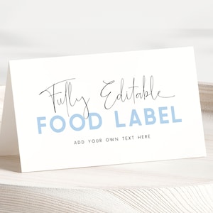 Plantilla de etiquetas de comida para el primer cumpleaños de un elefante. Etiqueta de comida editable para decoración de fiesta de cumpleaños de un elefante. Tarjetas de lugar para el cumpleañero de un elefante azul, BB7