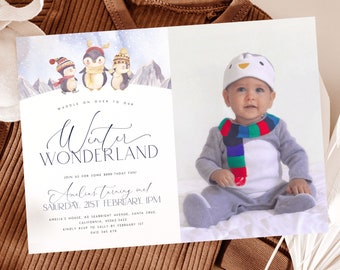 May include: A blue and white winter wonderland themed baby shower invitation with a penguin illustration and a photo of a baby dressed as a penguin. The invitation reads "Waddle on over to our Winter Wonderland. Join us for some birthday fun! Amelia's turning one! Saturday, 21st February, 1pm. Amelia's house, 60 Seabright Avenue, Santa Cruz, California, 95062-3432. Kindly RSVP to Sally by February 1st. 0412 345 678"