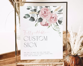 May include: A printable sign with a floral design featuring pink roses and green leaves. The text on the sign reads "Fully editable CUSTOM SIGN ADD TEXT TO MAKE THE SIGN YOUR OWN.. CUSTOM SIGNS CAN GIVE GUESTS EXTRA INFO, MAKE TABLE MESSAGES, ETC."