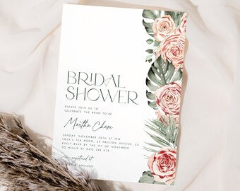 May include: A white bridal shower invitation with a floral border. The invitation features a green and pink floral design with the text "BRIDAL SHOWER" in black and the text "Martha Chase" in cursive. The invitation also includes the date, time, and location of the shower.