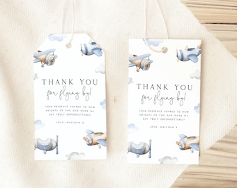 May include: Two blue and brown aeroplane thank you tags with white clouds and the text "Thank you for flying by!"  Your presence soared to new heights of fun and made my day truly unforgettable! Love, Malcolm X