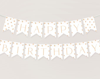 May include: A white banner with peach-patterned flags that spell out "Happy Birthday" in gold lettering.