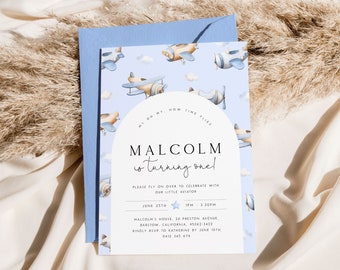 May include: A blue and white invitation with a watercolor illustration of airplanes. The text reads "My oh my, how time flies! Malcolm is turning one!" with details about the party, including the date, time, and location.