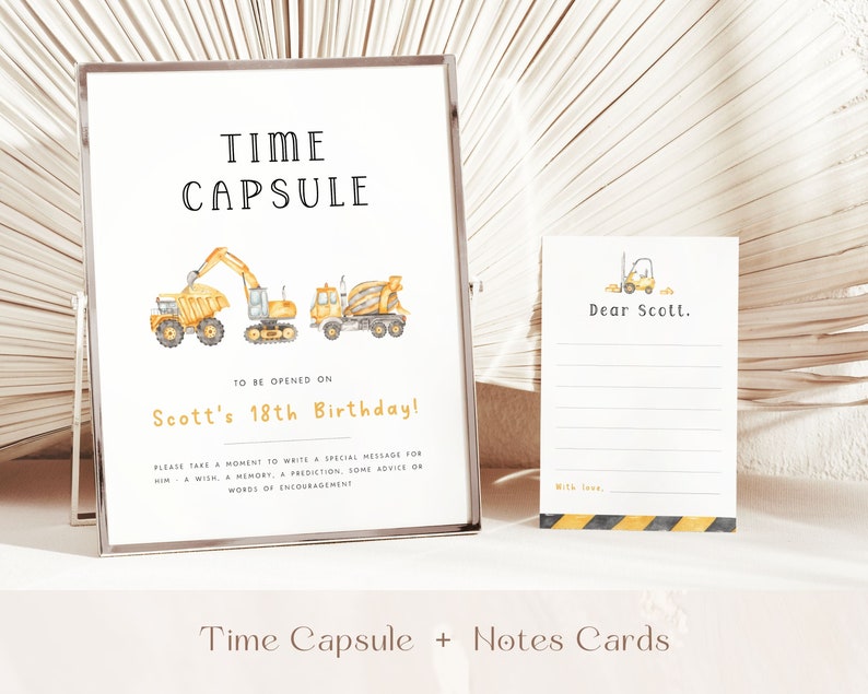 May include: A yellow and black time capsule sign with construction vehicle illustrations. The sign says "Time Capsule" and "To be opened on Scott's 18th Birthday!"  It also includes instructions to write a special message for Scott.  A blank note card with a yellow construction vehicle illustration is also shown.