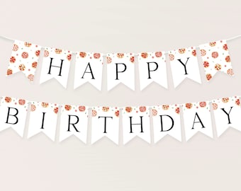 May include: A white banner with a pizza pattern and the words "Happy Birthday" in black letters.