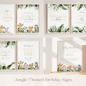 May include: A set of ten printable jungle-themed birthday party signs with gold text and watercolor illustrations of animals and greenery. The signs include "Adopt a Wild Animal", "Guess How Many Animal Crackers Are in the Jar", "Watering Hole", "Feed the Animals", "Cards and Gifts", "Thanks for a Wild Time", and "Fully Editable Custom Sign".