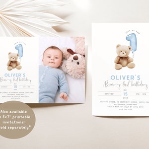 May include: A blue and white invitation for a first birthday party with a teddy bear holding a blue balloon shaped like the number one. The invitation says "Oliver's Bear-y first birthday" and includes the date, time, and location of the party.