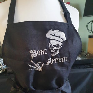 Bone Appetit Skull Chef Kiss | Cooking Baking Black Adjustable Apron | Goth Home Decor Accessories Gift Kitchen Pun Spooky Halloween Horror