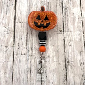 Glitter Jack O' Lantern Badge Reel: Halloween Alligator Clip Badge Holder