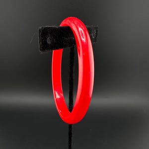 May include: A rustic wooden sign with the text "Welcome to our home" in white lettering. The sign features a distressed finish and a simple, inviting design, perfect for a front porch or entryway.