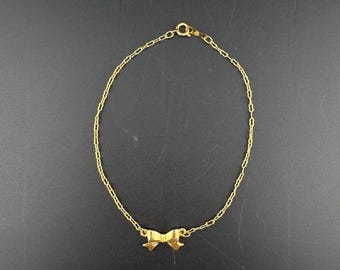 Tobillera vintage con dije de lazo - Cadena delicada tono dorado - 9"