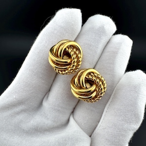 Pendientes vintage Napier con cierre de clip, nudo infinito, tono dorado, firmados.