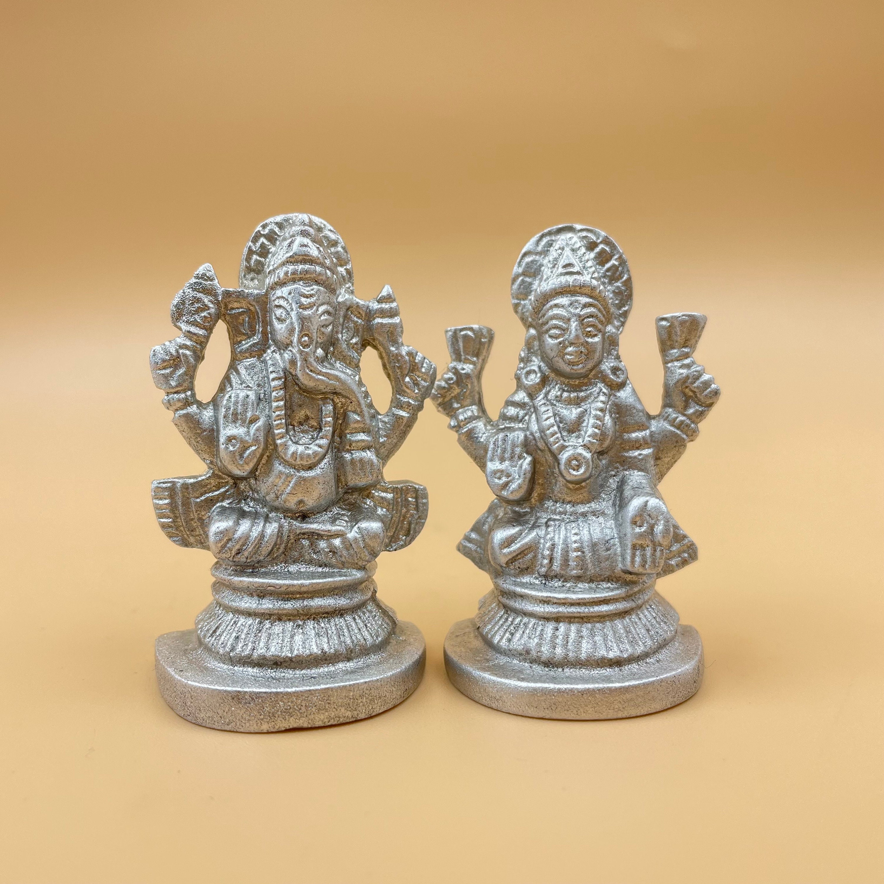 Silver ganesh laxmi murti shop price tanishq