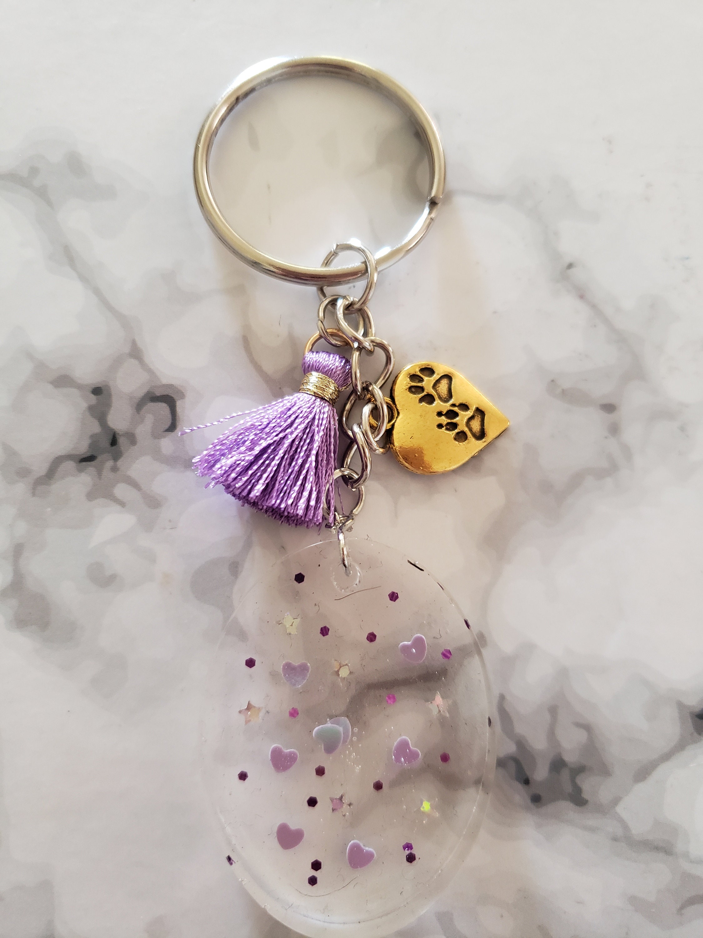 Transparent oval keychain with purple mini tassel Etsy