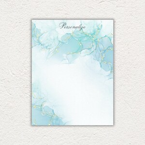 May include: A light blue background with gold glitter accents. The text "Personalize" is written in black cursive at the top of the image.