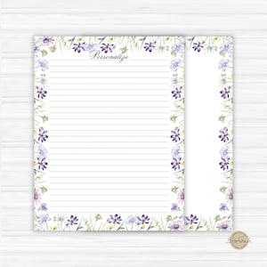 May include: White lined stationery set with a floral border in shades of purple, lavender, and green. The word "Personalize" is written in cursive at the top. Includes a notepad and a smaller notepad.