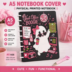 May include: A black A5 notebook with a white disc-bound spine. The cover features a white ghost character wearing pink heart-shaped glasses and a pink bow, surrounded by pink and white illustrations including a disco ball, a to-do list, and a boombox.