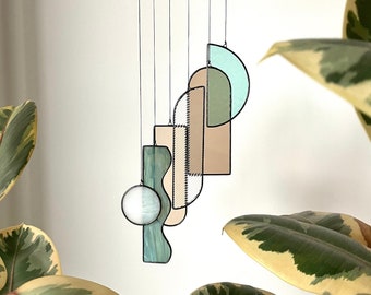 Art Deco inspired abstract stained glass mobile / suncatcher in neutral / green colour