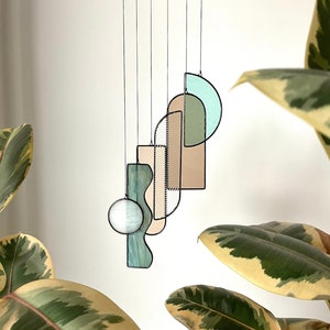 Art Deco inspired abstract stained glass mobile / suncatcher in neutral / green colour
