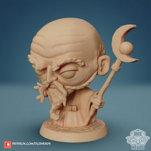 May include: A miniature figurine of a bald, bearded wizard with a long white beard and a closed eye. He is holding a staff with a crescent moon and a sphere at the top. The figurine is painted in a light brown colour.