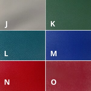 May include: Five different color swatches of leather material. The swatches are labeled J, K, L, M, and O. The colors are light gray, dark green, teal, blue, and burgundy.