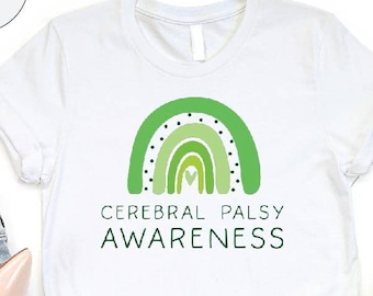 May include: White t-shirt with a green rainbow design and the text "Cerebral Palsy Awareness".