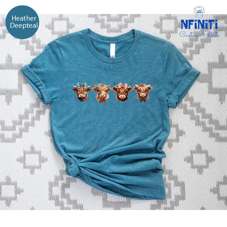 a t - shirt that has three cows on it