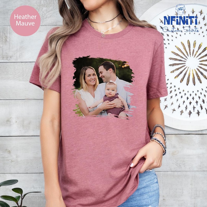 a woman wearing a t - shirt with a picture of a man and a woman