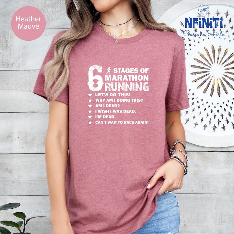 a woman wearing a t - shirt that says six stages of marathon running