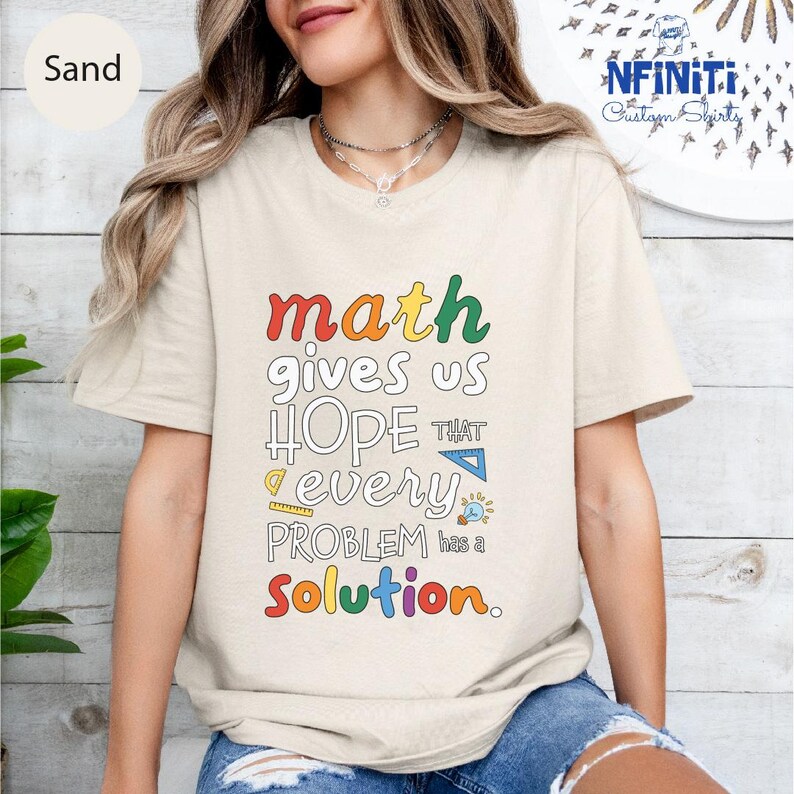 a woman wearing a t - shirt that says math gives us hope that every problem