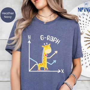 May include: A heather navy blue t-shirt with a white graphic of a giraffe on a graph. The text "G-Raph" is above the giraffe.