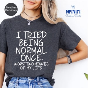 a woman wearing a t - shirt that says i tried being normal once