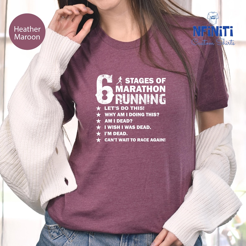 a woman in a maroon shirt is talking on a cell phone