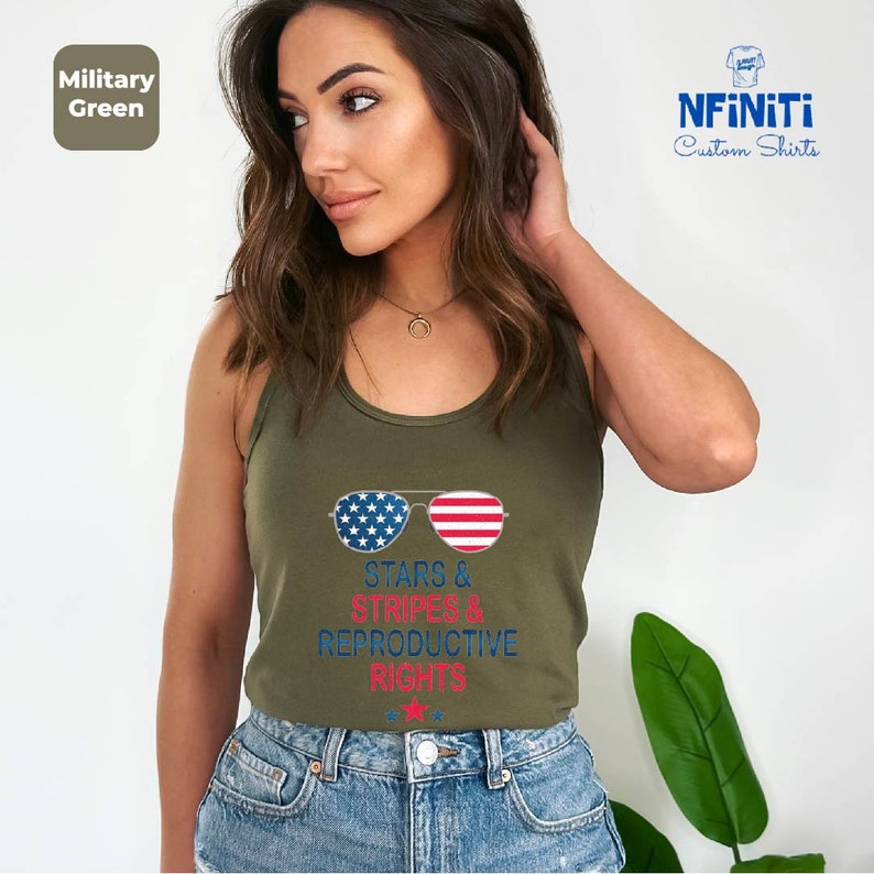 a woman wearing a military green tank top