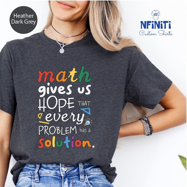 a woman wearing a t - shirt that says math gives us hope that every problem