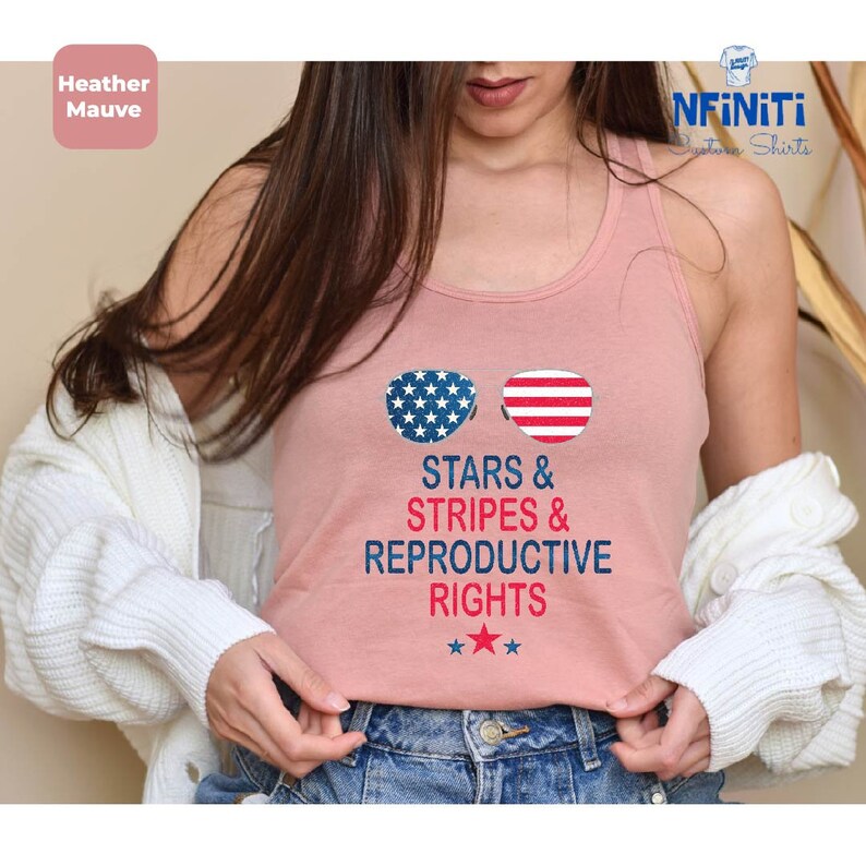 a woman wearing a tank top that says stars and stripes and reprodutive