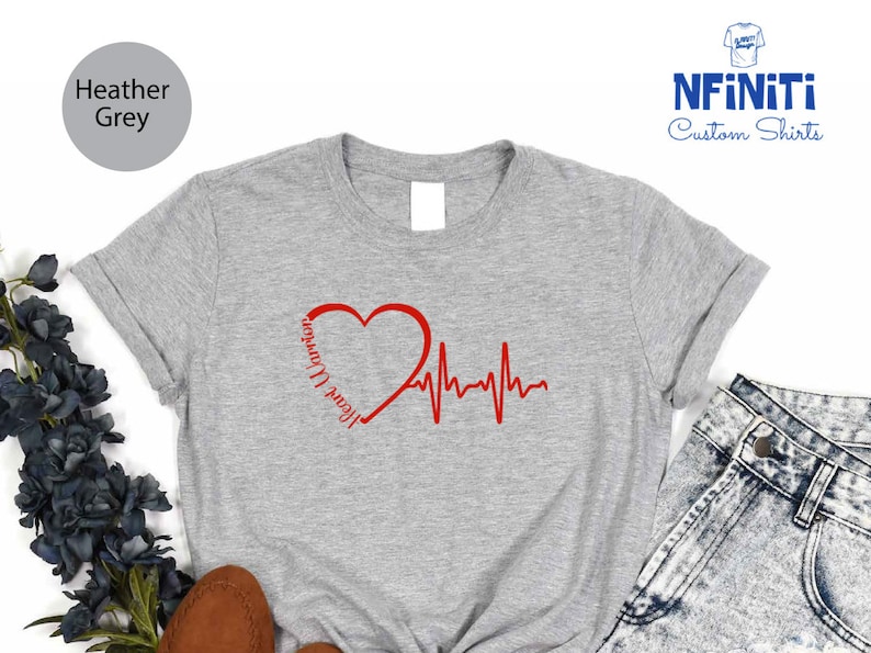 a t - shirt with a heart and heartbeat on it