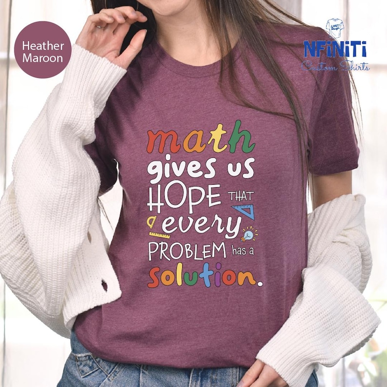 a woman wearing a t - shirt that says math gives us hope that every problem